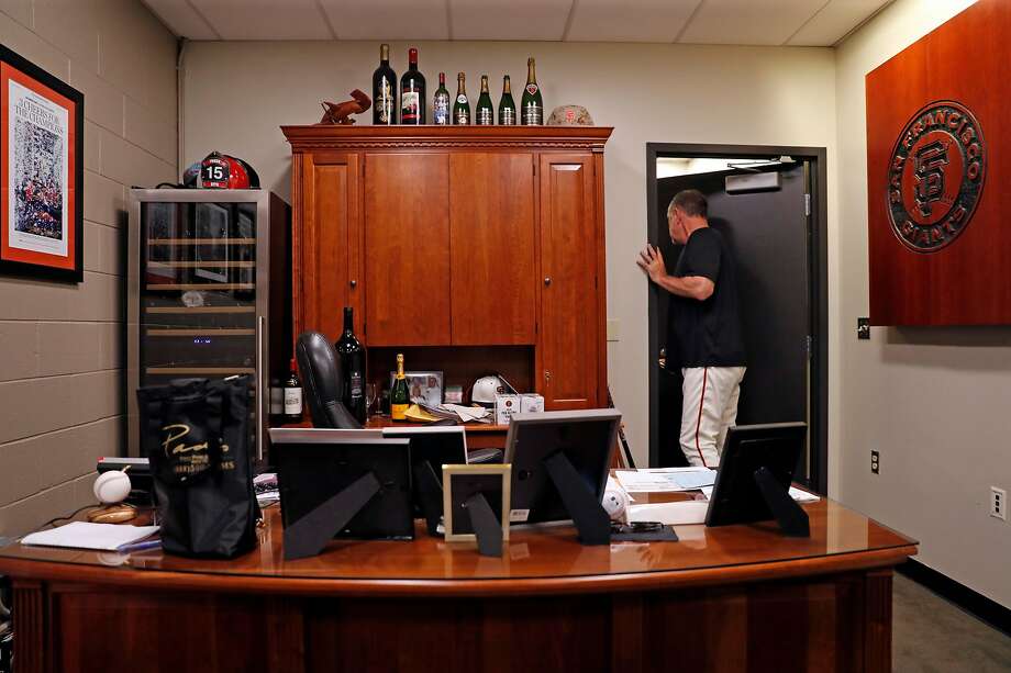 San Francisco Giants' manager Bruce Bochy checks with the analytics staff before game against Arizona Diamondbacks at Oracle Park in San Francisco, Calif., on Tuesday, August 27, 2019. Photo: Scott Strazzante / The Chronicle