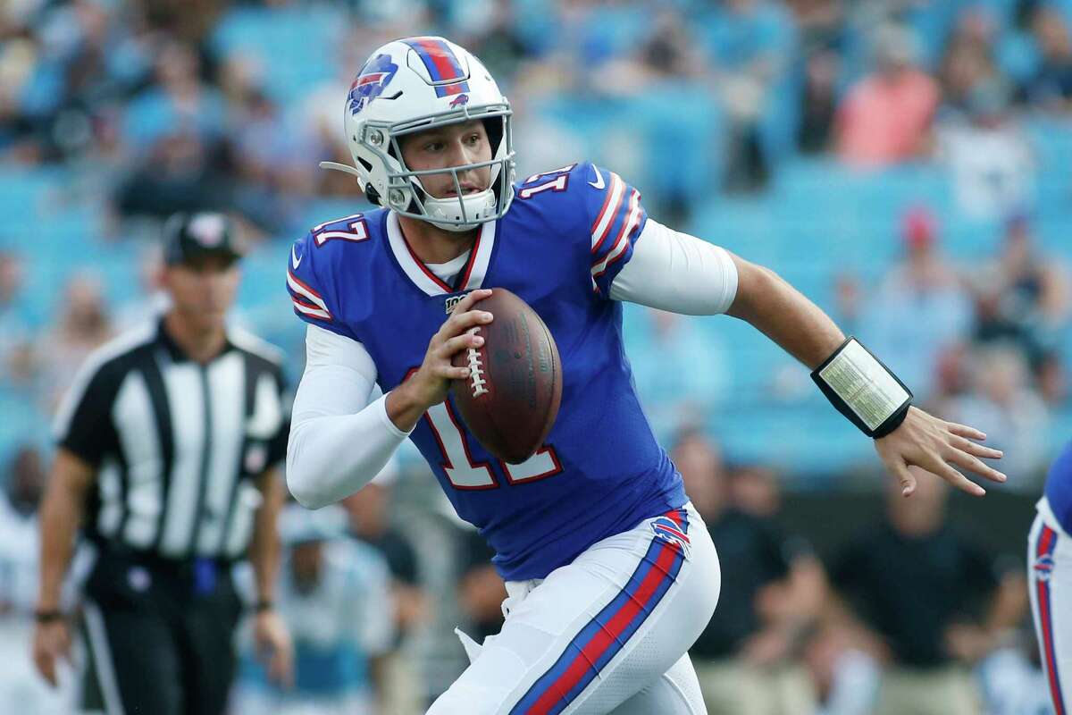 FILE - In this Aug. 16, 2019, file photo, Buffalo Bills quarterback Josh Allen (17) runs out of the pocket against the Carolina Panthers during the first half an NFL preseason football game, in Charlotte, N.C. Given the many variables that go into developing an elite quarterback, Pro Football Hall of Famer Jim Kelly can't even imagine assessing what to make of last year's group of five first-round draft picks as they enter their sophomore seasons. (AP Photo/Brian Blanco, File)