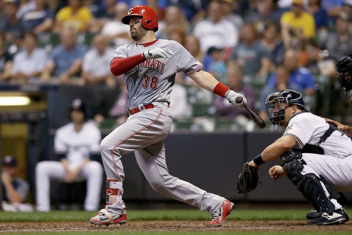 Curt Casali of the Cincinnati Reds hits a single in the fourth inning against the Milwaukee Brewers at Miller Park on September 17, 2018.