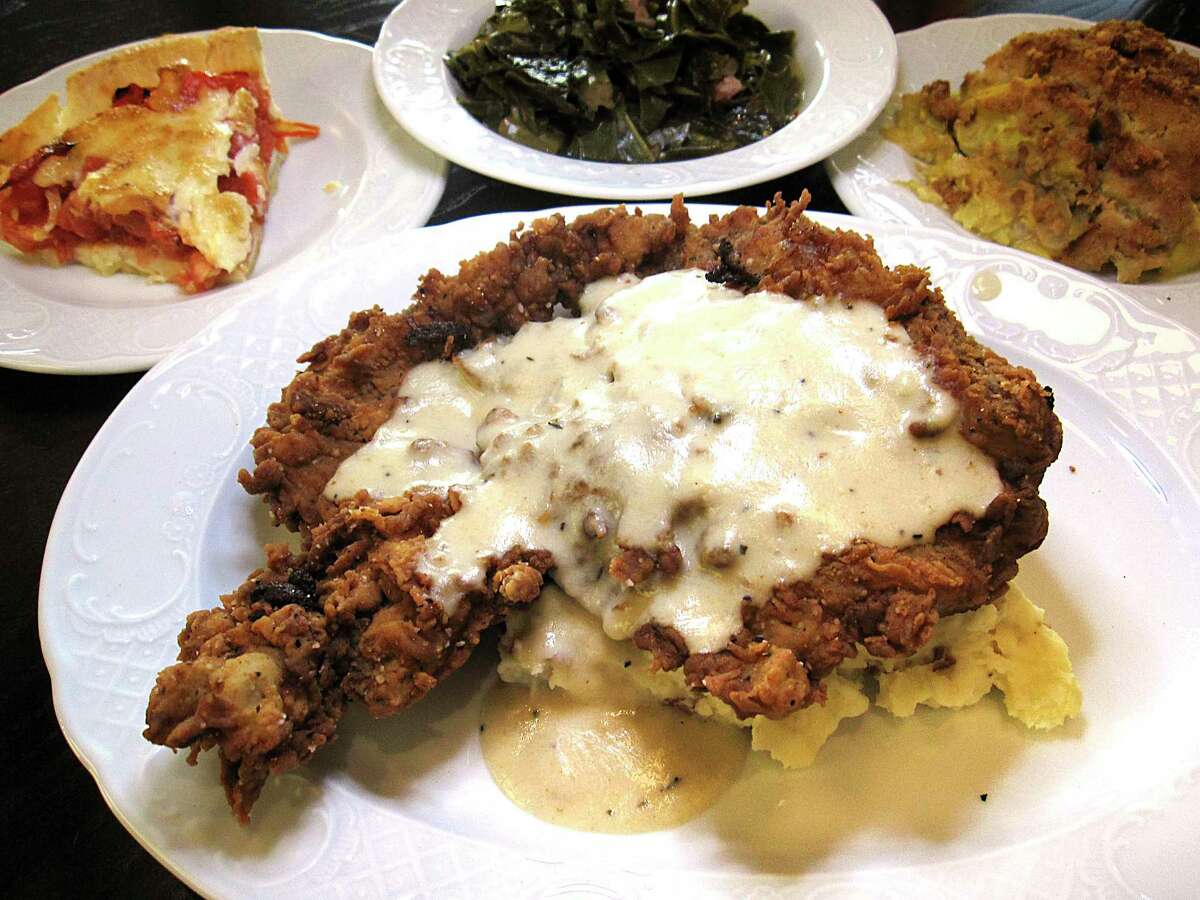 Chicken-fried steak comes with cream gravy and mashed potatoes at Fontaine's Southern Diner & Bar. Optional sides include tomato pie, collard greens and squash casserole.