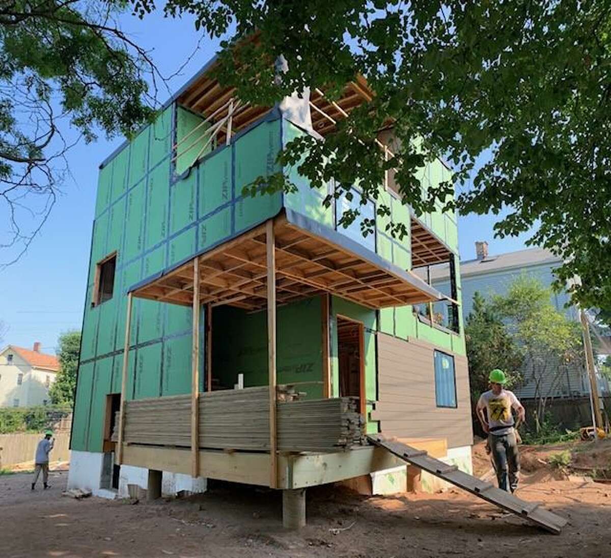 A triplex nearing completion on Plymouth Street in New Haven, designed and being built by first-year students at the Yale School of Archtecture as part of the Jim Vlock Building Project.