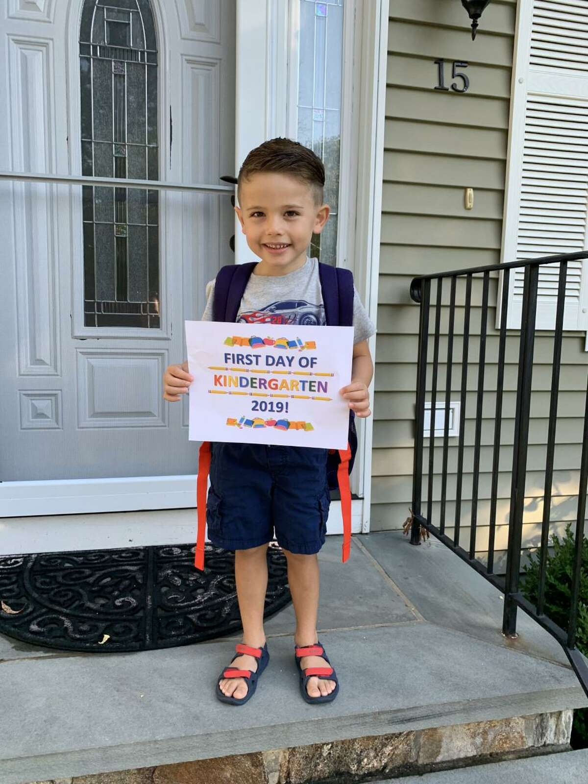 Daniel DeMasi is all smiles as he starts his first day of kindergarten at Frenchtown Elementary School.