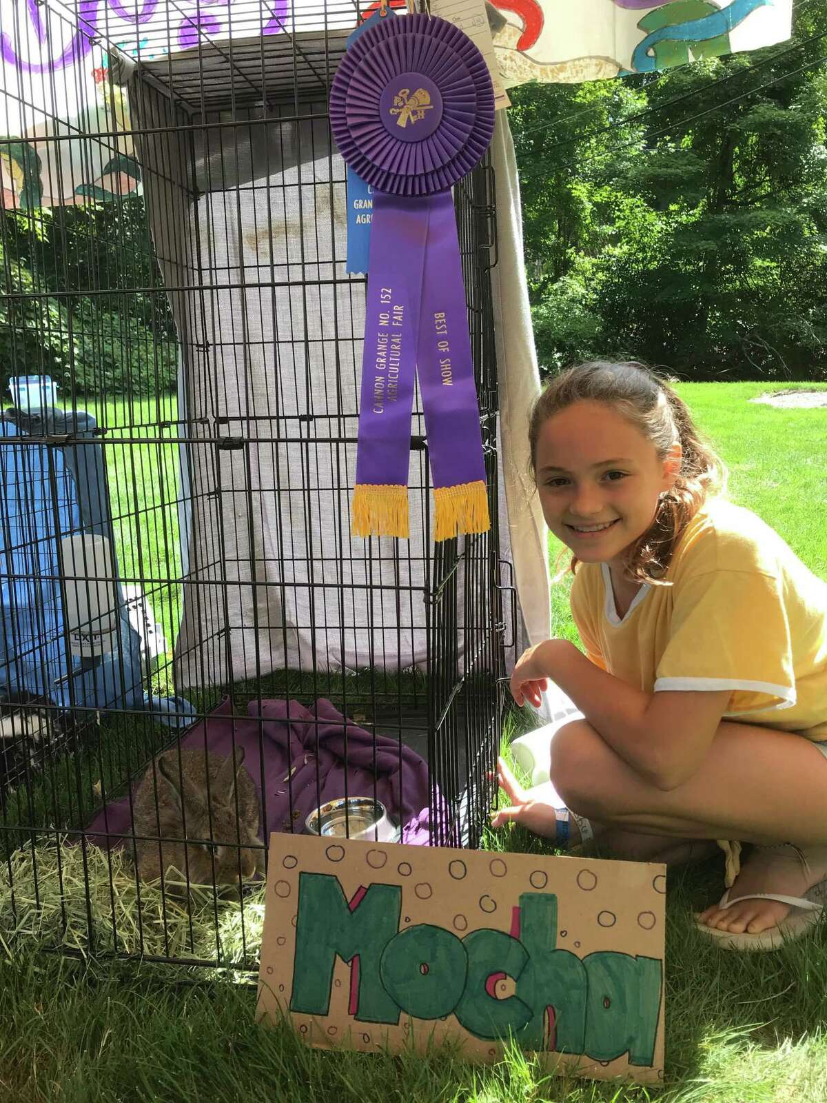 Abby Jones, 12, of Wilton, was proud to see her bunny, Mocha, win a “Best in Show” ribbon at the Cannon Grange’s 87th annual agricultural fair and exposition on Sunday, Aug. 25.