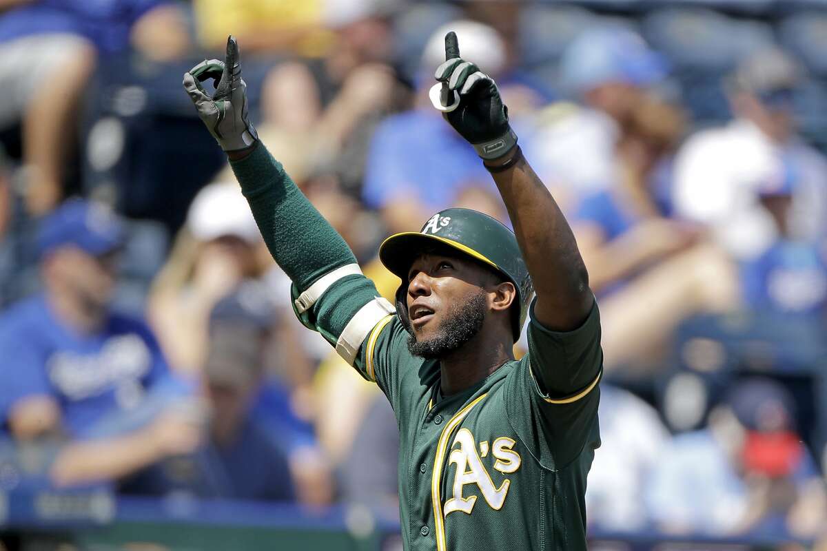 Oakland Athletics' Jurickson Profar celebrates as he crosses the plate after hitting a two-run home run during the fourth inning of a baseball game against the Kansas City Royals Thursday, Aug. 29, 2019, in Kansas City, Mo. (AP Photo/Charlie Riedel)