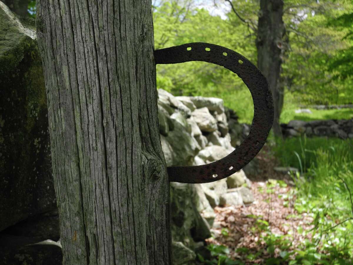 The horse is long gone, but its shoe remains, framing one of the historic stone walls at Weir Farm National Historic Site. The farm’s stone walls are the subject of a guided tour on Friday, Sept. 6.