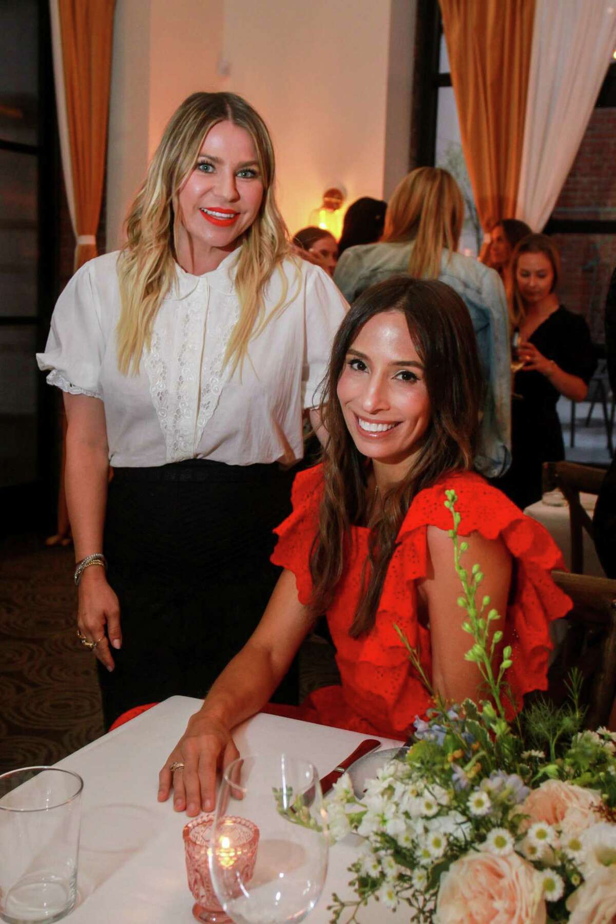 Emily Current, left, and Meritt Elliott at dinner at Indianola, where the designers unveiled their new collection for Pottery Barn. August 23, 2019.