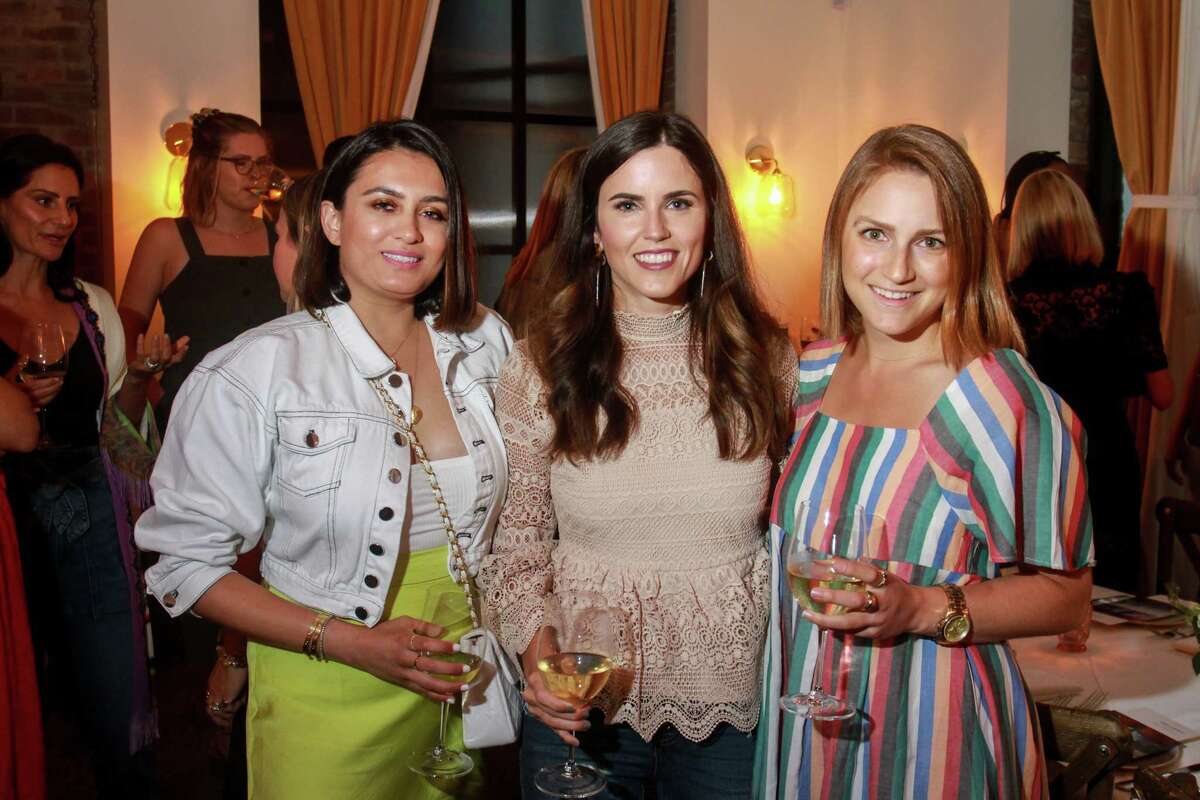Sarah Adam, from left, Brittany Fullwood and Serena Famalette at dinner at Indianola, where former denim designers Emily Current and Meritt Elliott unveiled their new collection for Pottery Barn. August 23, 2019.