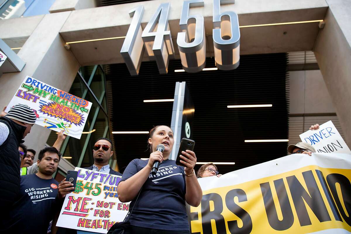 Annette Rivero, an organizer with Gig Workers Rising, gives a speech during a protest outside of Uber's Headquarters on Market Street in San Francisco, Calif. on Tuesday, August 27, 2019. Tuesday's protest is part of a three-day drive from Los Angeles to Sacramento to advocate for bill AB5 that would classify gig workers as employees.