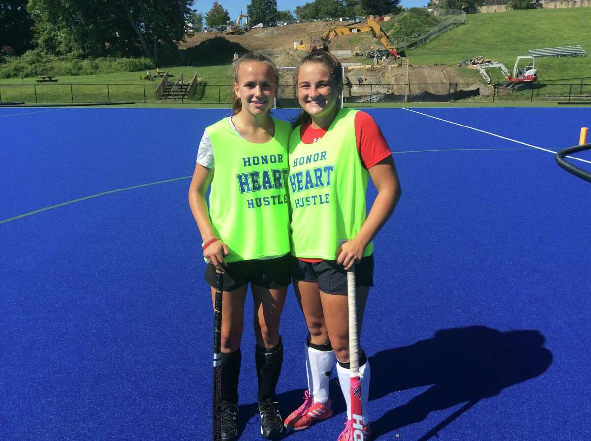 Sydney Gallop, left, and Morgan Smith are senior captains on the Sacred Heart Greenwich field hockey team.