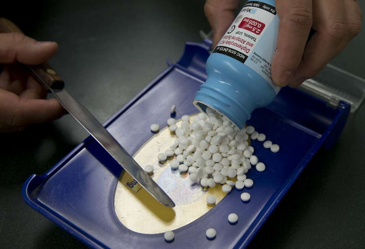 In this file photo, a pharmacist technician in Sacramento is filling a drug prescription. Op-ed author Wendye Robbins argues that a state bill to prevent drug manufacturers from entering into "pay for delay" agreements with generic drug companies is well-meaning, but would not improve affordability for patients.