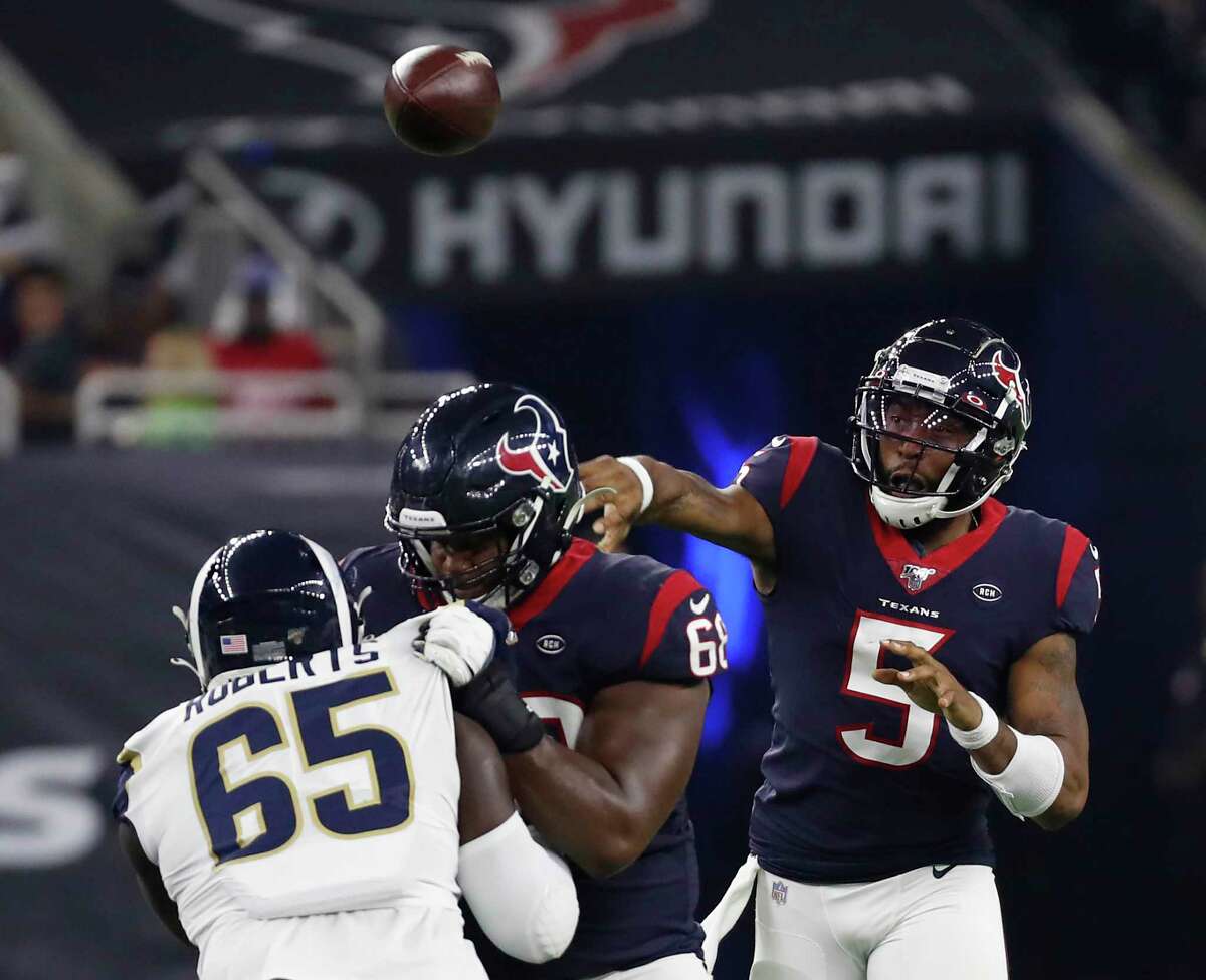 Houston Texans quarterback Joe Webb (5) throws a pass over Los Angeles Rams defensive tackle Boogie Roberts (65) during an NFL preseason football game at NRG Stadium on Thursday, Aug. 29, 2019, in Houston.
