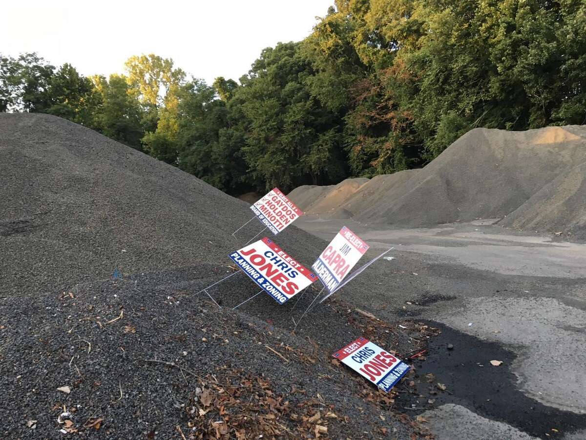 Jim Capra, a member of Here for Shelton and running for Board of Aldermen's fourth ward, claims that campaign signs for members of his group were stolen, with some dumped at the Nike site.
