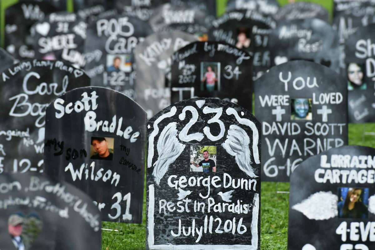 Gravestones representing some of the state's population lost to overdose are placed in West Capitol Park during Capital Region Overdose Awareness Day events on Friday, Aug. 30, 2019, in Albany, N.Y. (Will Waldron/Times Union)