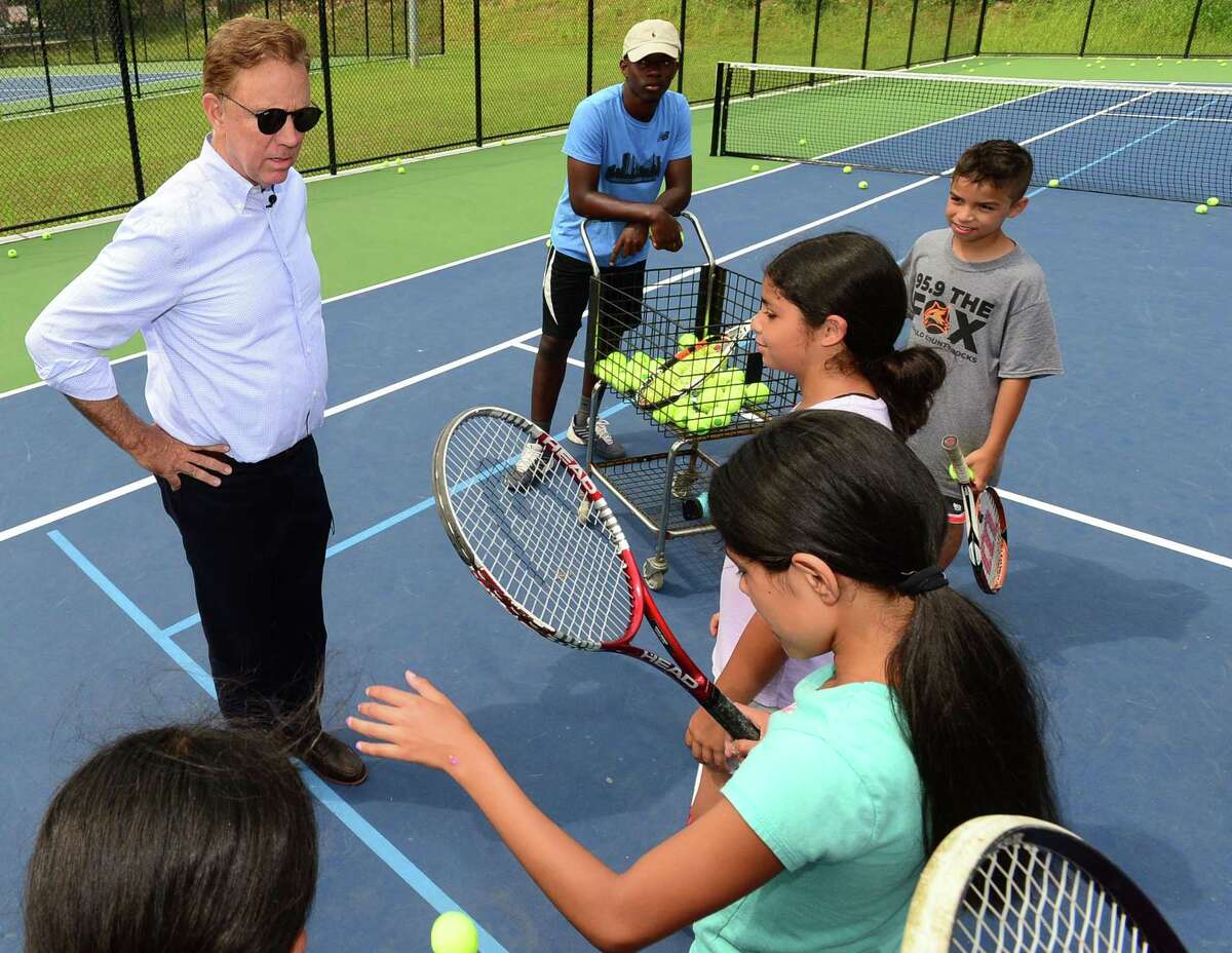 Connecticut Governor Ned Lamont embarks on his "Day in the Life" tour of Roodner Court Housing Complex, the Grassroots Tennis facility and other areas of the city Wednesday, August 7, 2019, in Norwalk, Conn.