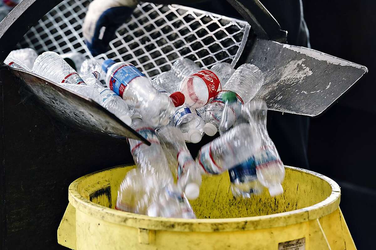 Plastic bottles are stopped into a can at Our Planet Recycling in San Francisco, Calif, on Tuesday, August 6, 2019.