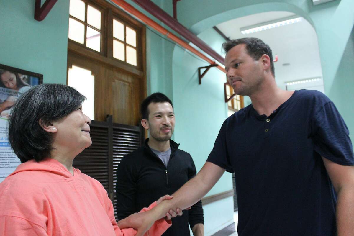 San Francisco Supervisor Matt Haney meets with wounded Philippines activist Brandon Lee's mother, Louise, and brother Aaron, in the Baguio hospital where he is recovering.
