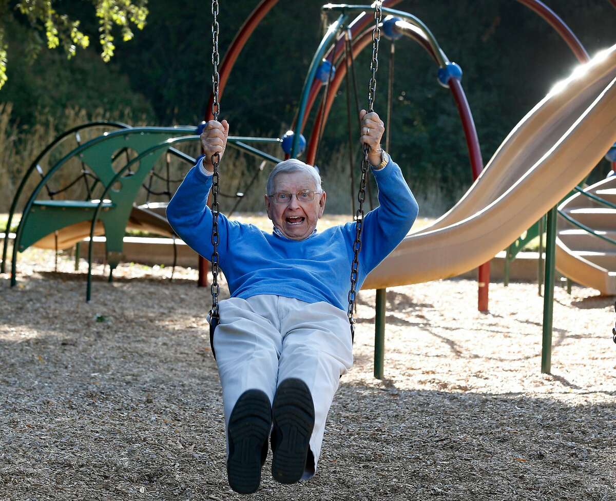 Jim Roberts, 92, rides on a swing of the play structure at the 50th playground he rebuilt in Buhman Park in Napa, Calif. on Friday, Aug. 30, 2019. Roberts and his team of volunteers from the local Kiwanis Club are constructing their 73rd playground on Sept. 7 at Playground Fantastico park.