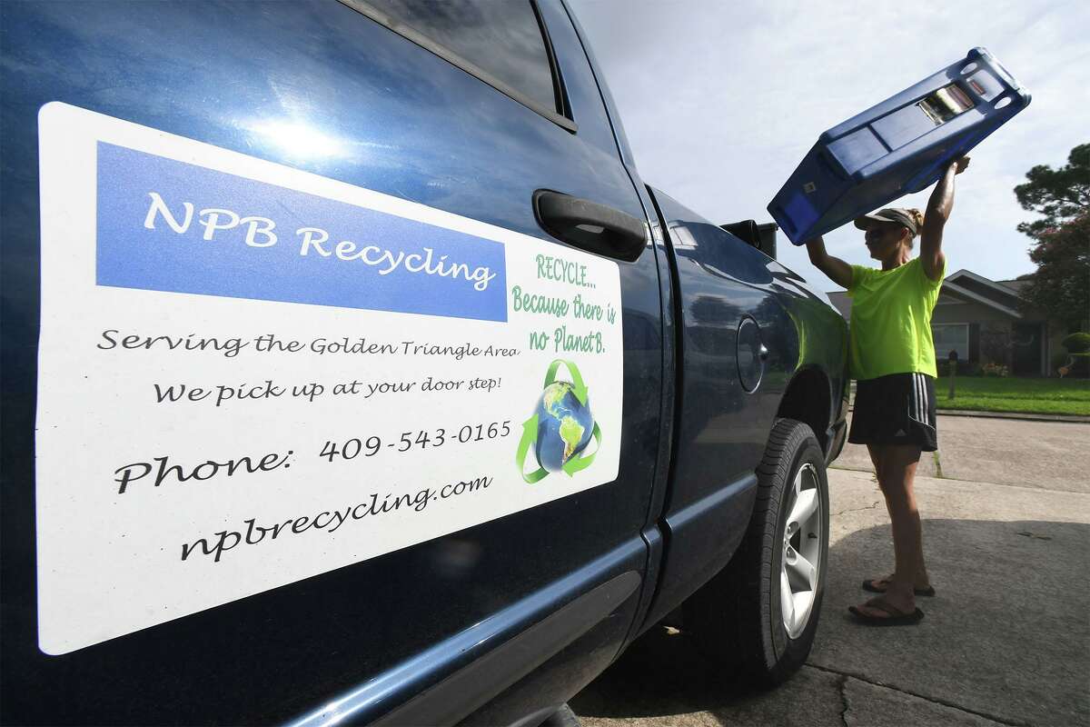 Co-owners of NPB recycling, Stacey Wheeler picks up recyclable material in Port Neches on Wednesday. The two women collect the material and bring it to facilities in Port Arthur and Houston to be recycled. Aycock said they collect all plastics, paper, any metal, aluminum, batteries, glass and cardboard. Photo taken Wednesday, 8/28/19