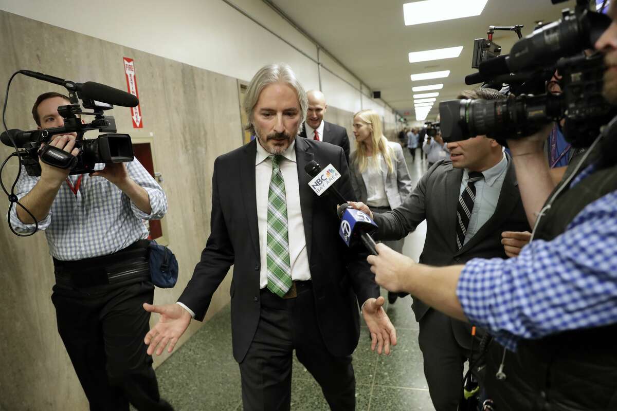 Matt Gonzalez, chief attorney of the San Francisco Public Defenders Office, center, fields questions after a verdict was reached in the trial of Jose Ines Garcia Zarate Thursday, Nov. 30, 2017, in San Francisco.