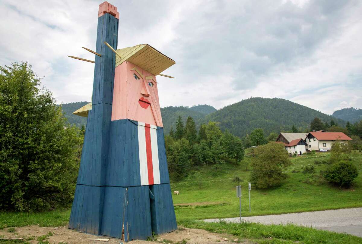 A wooden statue resembling Donald Trump is built near Kamnik, Slovenia, Friday, Aug. 30, 2019. Only weeks after Melania Trump statue was erected in her home town of Sevnica, Slovenia, another statue, now of her husband Donald, has been erected not far from there. (AP Photo/Darko Bandic)