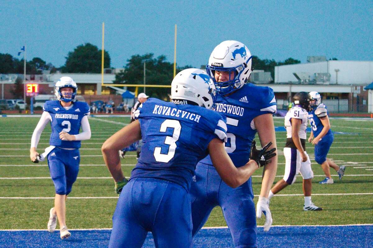 Friendswood's Matthew Kovacevich (3) and Cole Kelly (85) celebrate a touchdown against Dayton Friday, Aug. 30 at Friendswood High School.