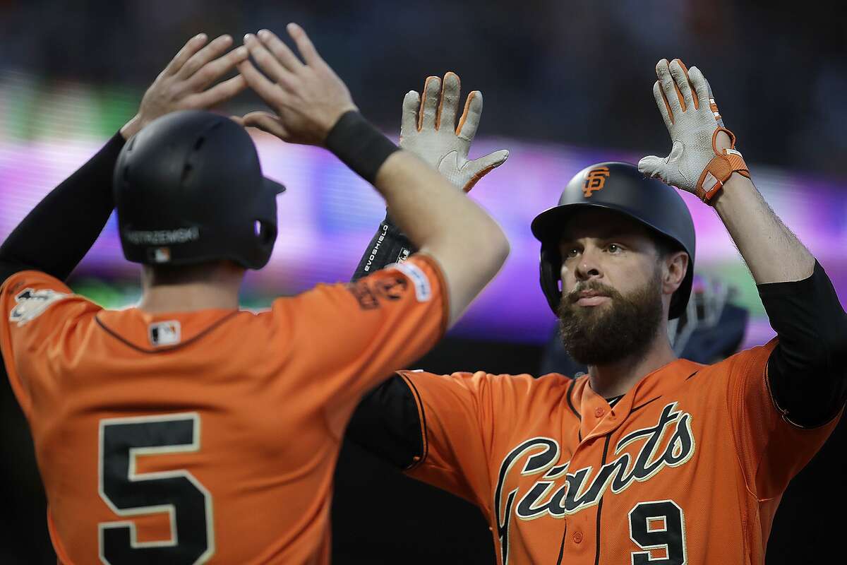 San Francisco Giants' Brandon Belt, right, celebrates with Mike Yastrzemski after hitting a two-run home run off San Diego Padres' Dinelson Lamet during the first inning of a baseball game Friday, Aug. 30, 2019, in San Francisco. (AP Photo/Ben Margot)