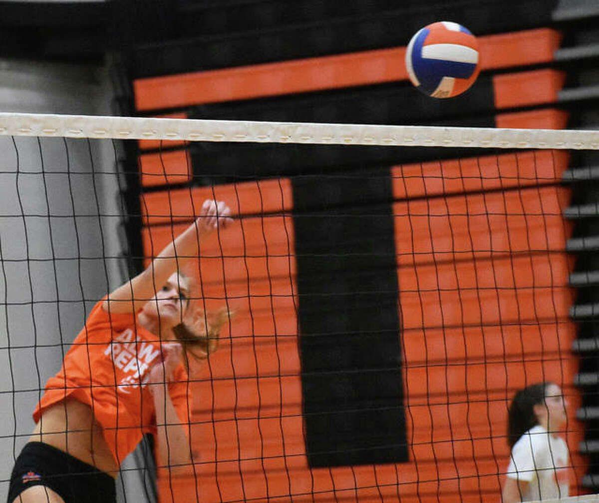 Edwardsville junior middle Storm Suhre with an attack during a practice inside Lucco-Jackson Gymnasium.