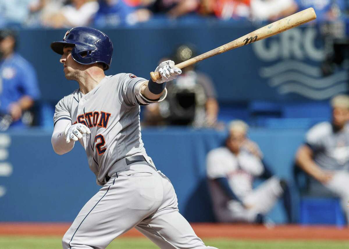 TORONTO, ONTARIO - AUGUST 31: Alex Bregman #2 of the Houston Astros hits an RBI sacrifice fly against the Toronto Blue Jays in the first inning during their MLB game at the Rogers Centre on August 31, 2019 in Toronto, Canada.