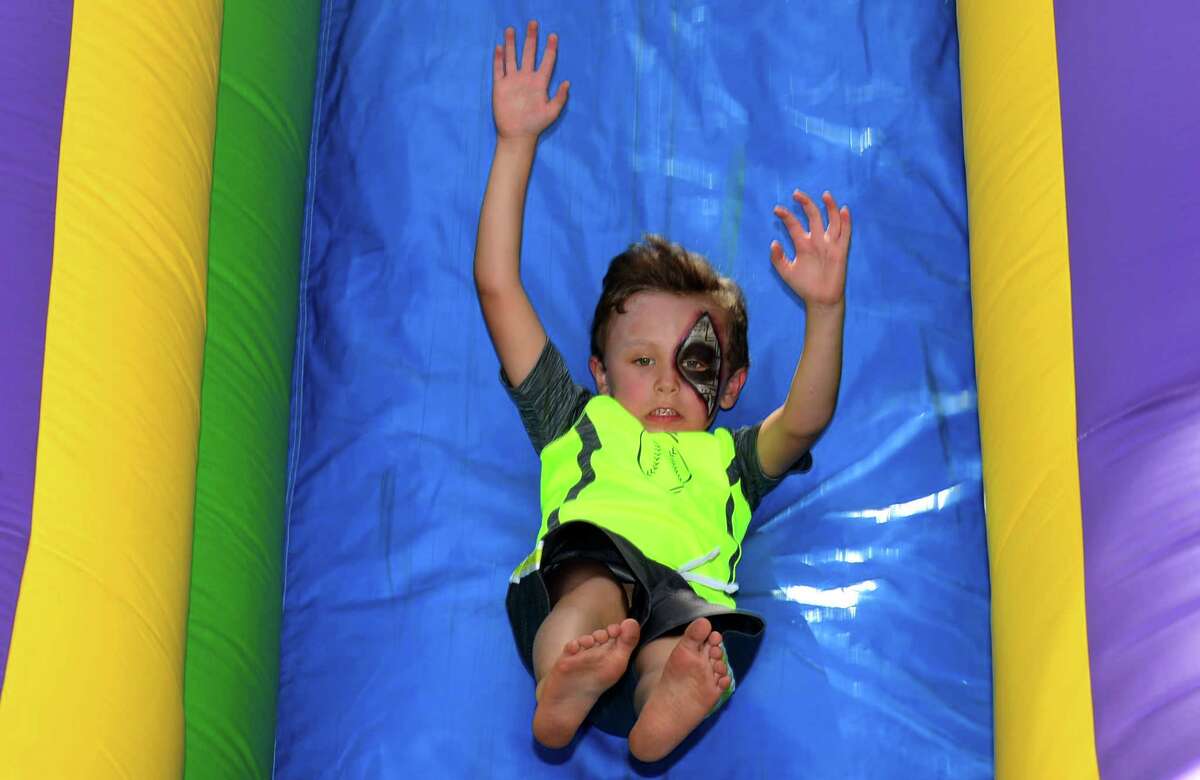 Danny Rooney, 5, of Stamford plays on the inflatale attractions during the The 12th annual Blues & Views Festival Saturday, August 31, 2019, at the Levitt Pavillion in Westport, Conn. A Fairfield County tradition since 2008, the festival continues Sunday and features a variety of established bands and soon-to-be-famous acts.