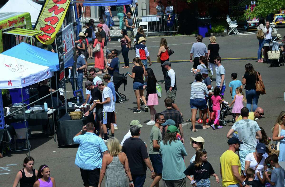 Attendess browse the food court during The 12th annual Blues & Views Festival Saturday, August 31, 2019, at the Levitt Pavillion in Westport, Conn. A Fairfield County tradition since 2008, the festival continues Sunday and features a variety of established bands and soon-to-be-famous acts.