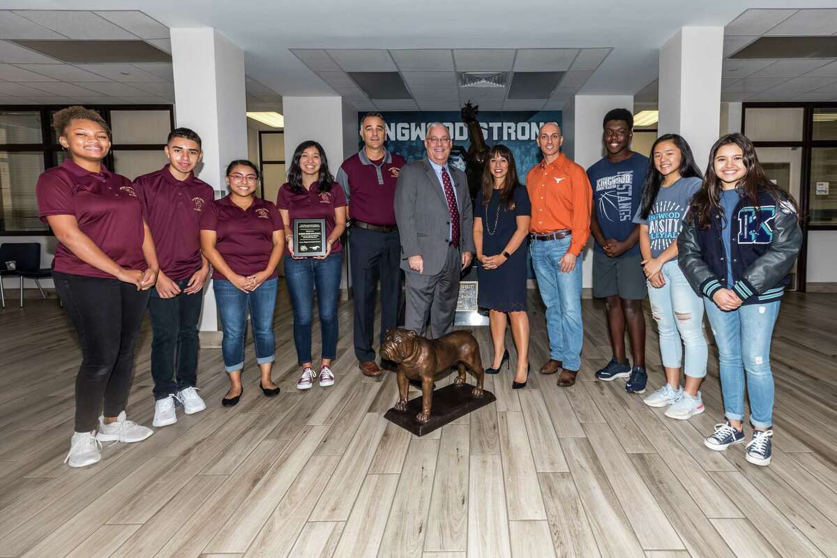 Students, school administrators and Humble ISD leadership take a moment on Aug. 30 to pose with a new bronzed bulldog mascot Kingwood High School students offered to Summer Creek High School students in appreciation of their help after Hurricane Harvey.  Pictured are (from l-r): Summer Creek Senior Jasmine Rose, Summer Creek Senior Andrew Guevara, Summer Creek Senior Lauren Argueta, Summer Creek Senior Audrey Leyva, Summer Creek Principal Brent McDonald, Humble ISD Assistant Superintendent of High Schools Trey Kraemer, Humble ISD Superintendent Dr. Elizabeth Fagen, Kingwood Principal Dr. Michael Nasra, Kingwood Senior Michael Hanson, Kingwood Senior Lizzy Young, Kingwood Senior Xomie Sukach.