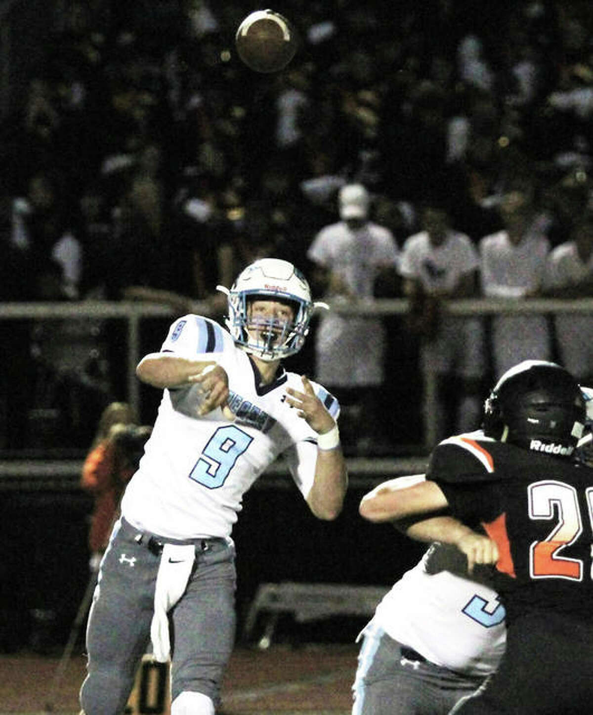 Jersey quarterback Matthew Jackson (left), shown throwing a pass in a game last season at Waterloo, ran for 170 yards and two touchdowns Saturday night in the Warriors’ season-opening victory at Granite City.