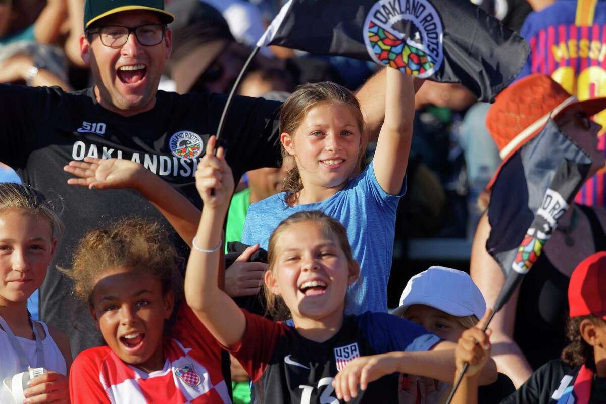 Fans cheer at the Oakland Roots first game on August 31, 2019 in Oakland. The Oakland Roots soccer team pledged that one percent of the team's salaries and ticket sales will be donated to social causes.