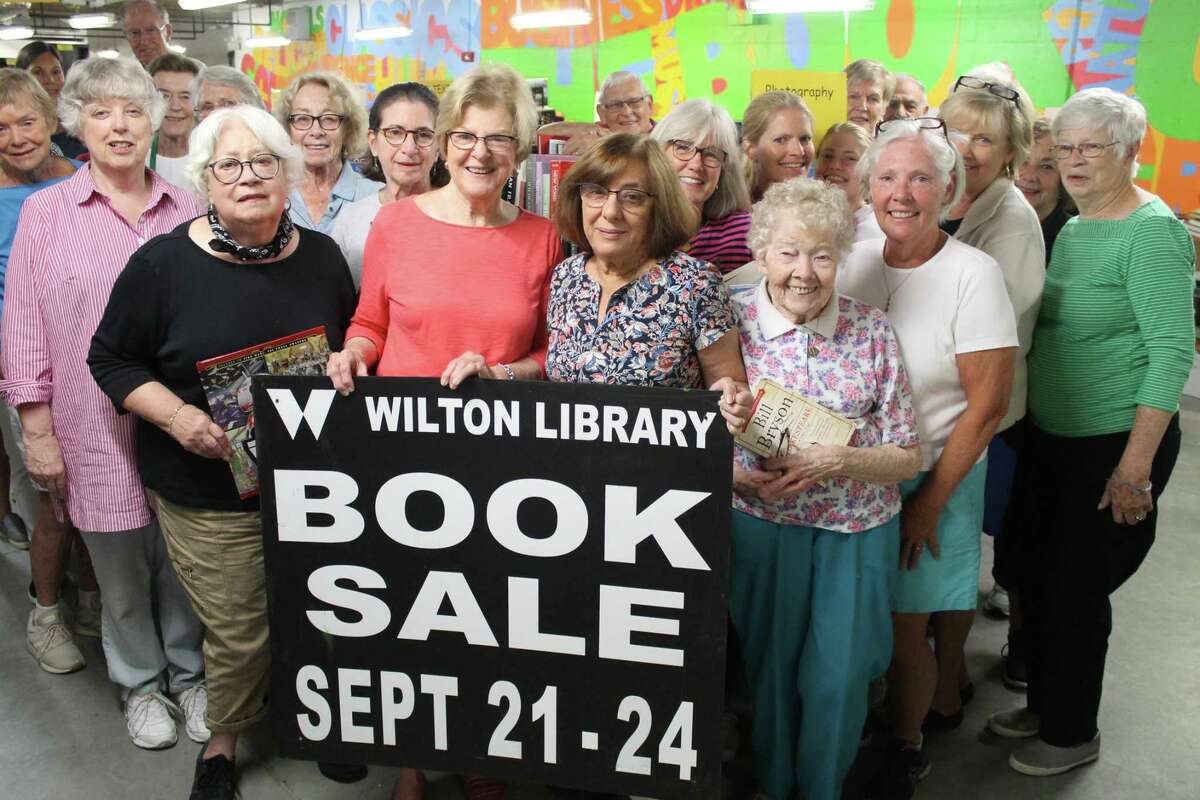 Wilton Library volunteers prepare for the Awesome Autumn Book Sale that will take place Sept. 21-24, 2019 at the library in Wilton, Conn.