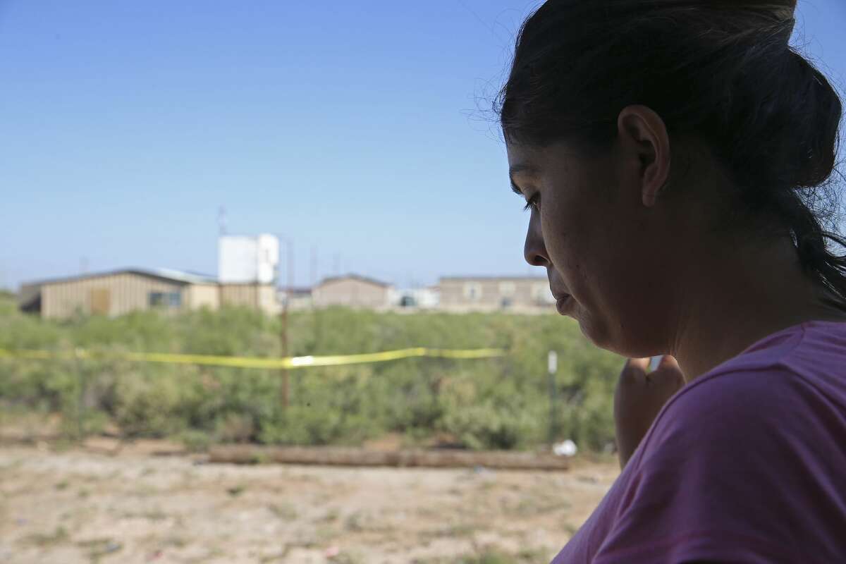 Veronica Alonzo, 29, talks about interactions with her neighbor, Seth Ator, 36, at their West Odessa, Texas neighborhood, Monday, Sept. 2, 2019. Ator lived in a aluminum shack, background, without electricity or running water in West Odessa. He is suspected in killing seven and injuring 22 people in a shooting rampage that started on IH-20 between Odessa and Midland, Texas, Saturday. Alonzo said that one time, Ator went to her trailer home with a rifle and complained about a trash issue.
