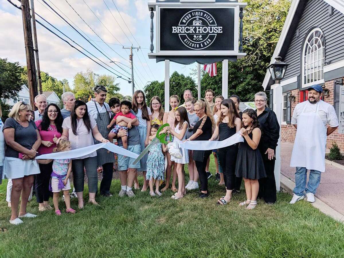 Brick House Wood Fired Pizza Kitchen & Bar open at 632 Danbury Road on Aug. 28. The new pizzeria is owned by Junio Filgueira and his wife Andrea Filgueira. Brick House celebrated its opening by cutting a Ridgefield Chamber of Commerce ribbon last week. Brick House has a sister restaurant, Tivoli Pizza and Trattoria in Danbury. The business also has a mobile pizza truck.