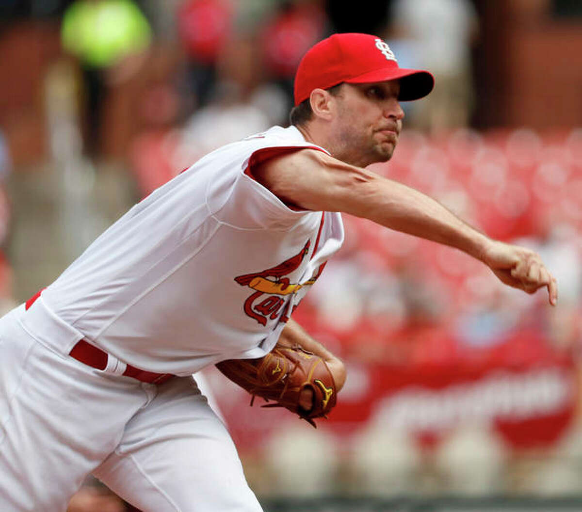 Cardinals pitcher Adam Wainwright throws during the fourth inning against the San Francisco Giants on Monday in St. Louis.