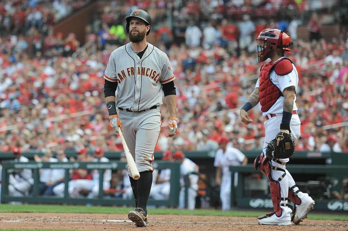 Brandon Belt of the San Francisco Giants strikes out in the eighth inning against the St. Louis Cardinals at Busch Stadium on Sept. 2, 2019 in St. Louis.  The Giants signed Darin Ruf, a former Philadelphia Phillie who, like Belt, plays first base, to a minor league deal.