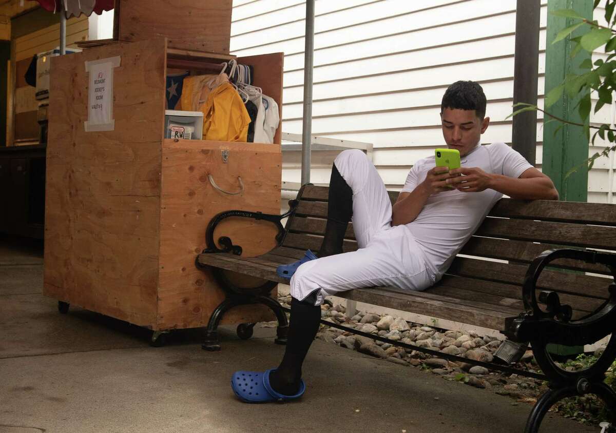 Jockey Eric Cancel spends some time on his phone in the jockey's area on Monday, Sept. 2, the final day of the 2019 meet at Saratoga Race Course in Saratoga Springs, N.Y. (Jenn March, Special to the Times Union )