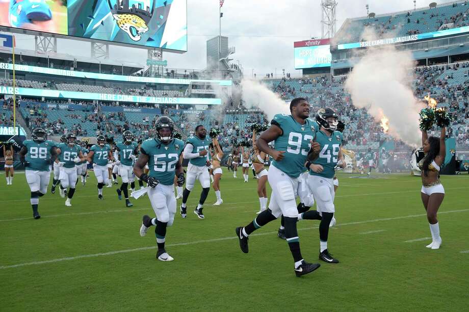 Linebacker Najee Goode (52) of Jacksonville Jaguars, Calais Campbell defensive wing (93) and linebacker Connor Strachan (49) clashed before the opening game of an NFL pre-season game. the Philadelphia Eagles on Thursday, August 15, 2019, in Jacksonville, Florida. (AP Photo / Phelan M. Ebenhack) Photo: Phelan Ebenhack / Associated Press / Copyright 2019 The Associated Press. All rights reserved