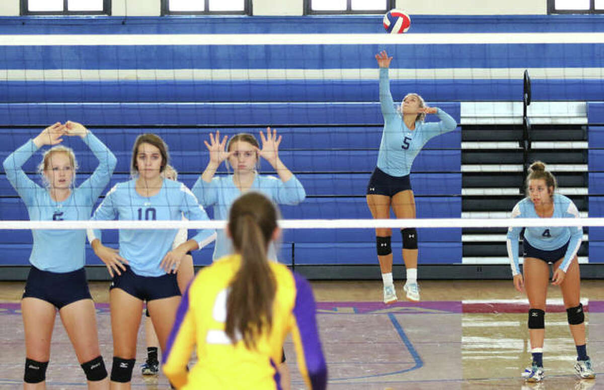 Jersey’s Clare Breden (5) gets off a jump serve for one of her eight aces against Civic Memorial in the championship match of the Roxana Invitational girls volleyball tournament on Saturday at Milazzo Gym in Roxana.