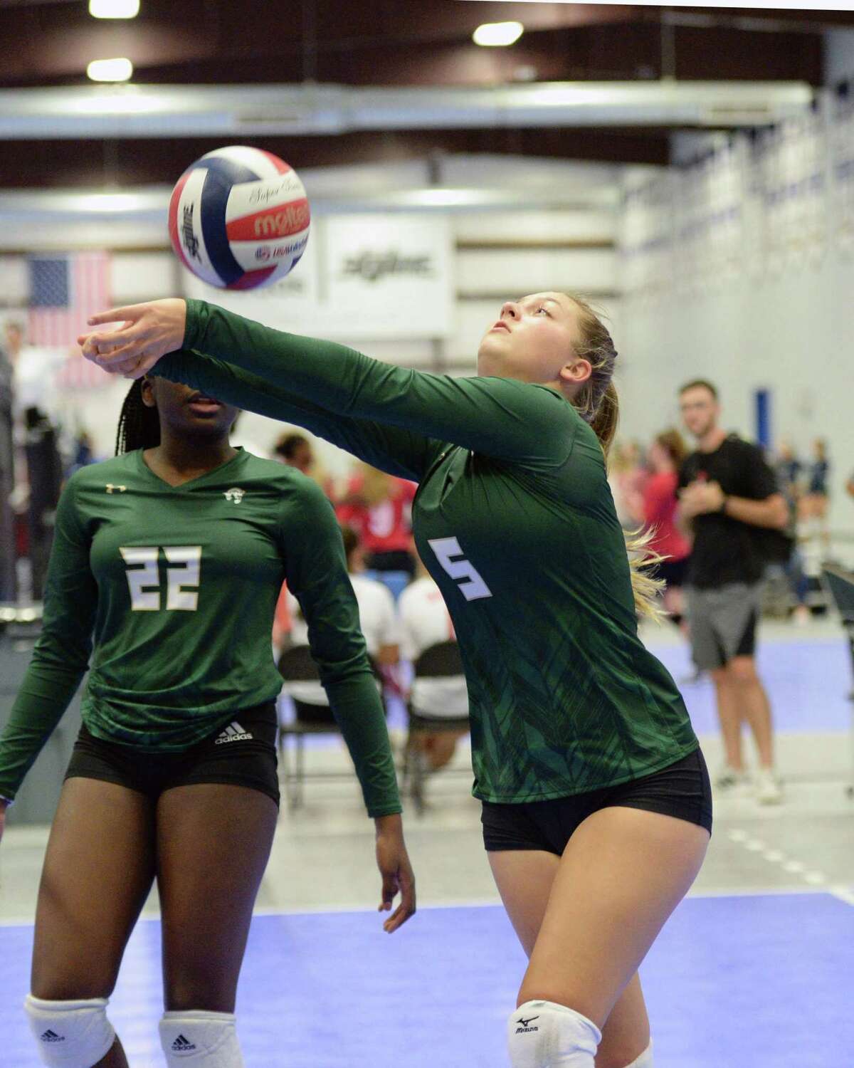 Teddy Laughton (5) of Awty digs for a ball during the first set of a volleyball match between the Awty International Rams and the Woodlands Christian Warriors on Friday, August 23, 2019 at Skyline Juniors, Houston, TX.
