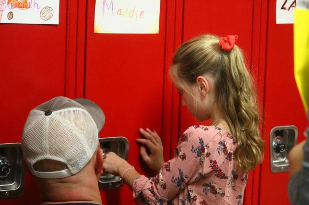 At the event, students were able to go into the hall and figure out how to use their lockers. They also met teachers, friends and were able to explore the school. (Pioneer photo/ Catherine Sweeney)