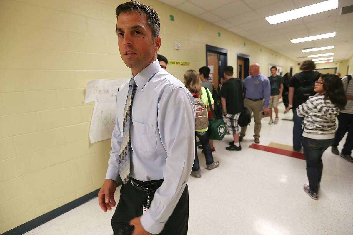 Principal Sean Maika, the future superintendent of North East ISD, walks the halls at Comal ISD’s Mountain Valley Middle School in 2013. Today he’s planning a budget for NEISD and is worried that the economic damage to the state caused by the coronavirus pandemic will lead to serious funding cuts.