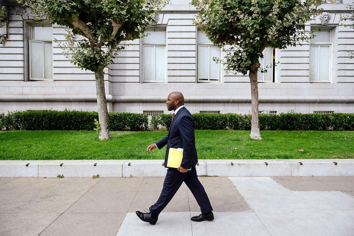 Dr. Anton Nigusse Bland, San Francisco's Director of Mental Health Reform, walks past City Hall in San Francisco, Calif, on Tuesday, September 3, 2019.