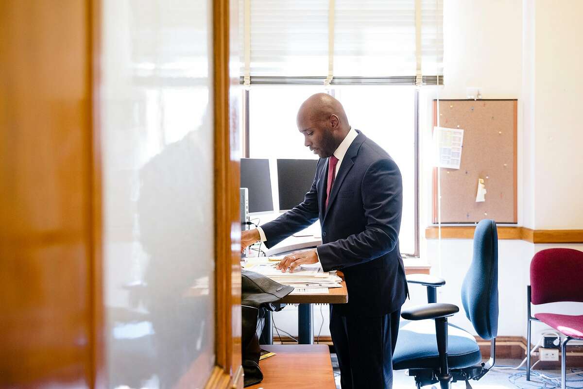 Dr. Anton Nigusse Bland, San Francisco's Director of Mental Health Reform, works in his office inside the Department of Public Health building in San Francisco, Calif, on Tuesday, September 3, 2019.