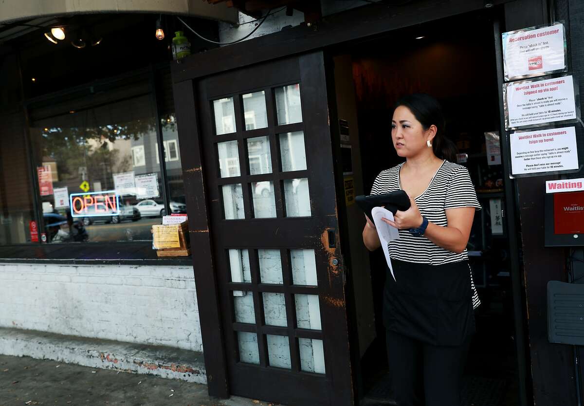 Shiho Akin, a hostess and server, works at Kiraku, a Japanese restaurant, located at 2566 Telegraph Ave., in Berkeley, Calif., on Wednesday, August 28, 2019. A court ruling in January 2018 allowed California restaurant owners to implement credit card surcharges for the first time in decades -- but very few Bay Area restaurants have actually begun doing so. Kiraku is one of few restaurants in the Bay Area already implementing a surcharge for credit card users.