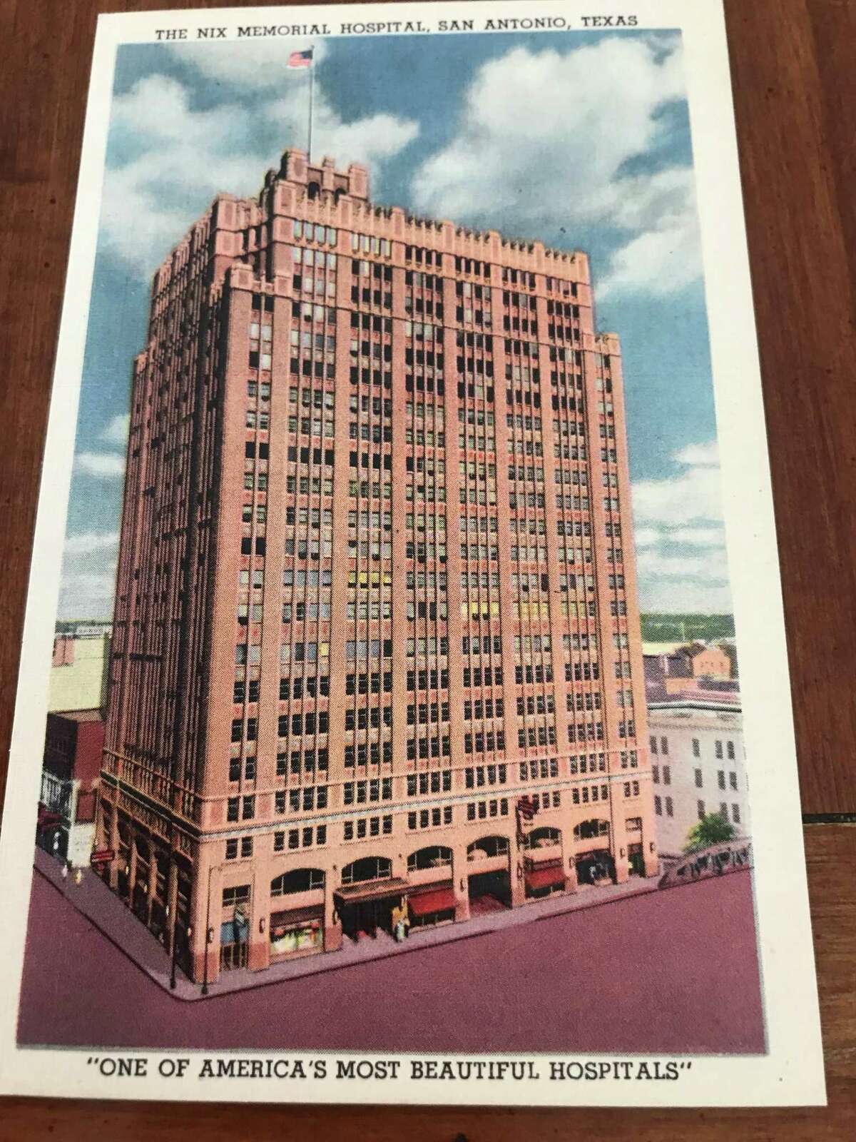 Nancy Avellar, who was born in the Nix Hospital in 1953, has a postcard she believes was placed in patient rooms (“like at a Holiday Inn,” she said). It shows a picture of the Nix against a sky of blue and clouds of white reading “One of America’s Most Beautiful Hospitals.”