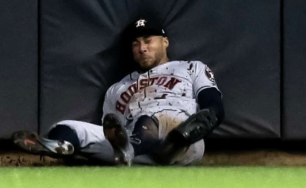 George Springer gave himself up while making a fifth-inning catch Tuesday night, hitting his head against the padded fence at Miller Park.