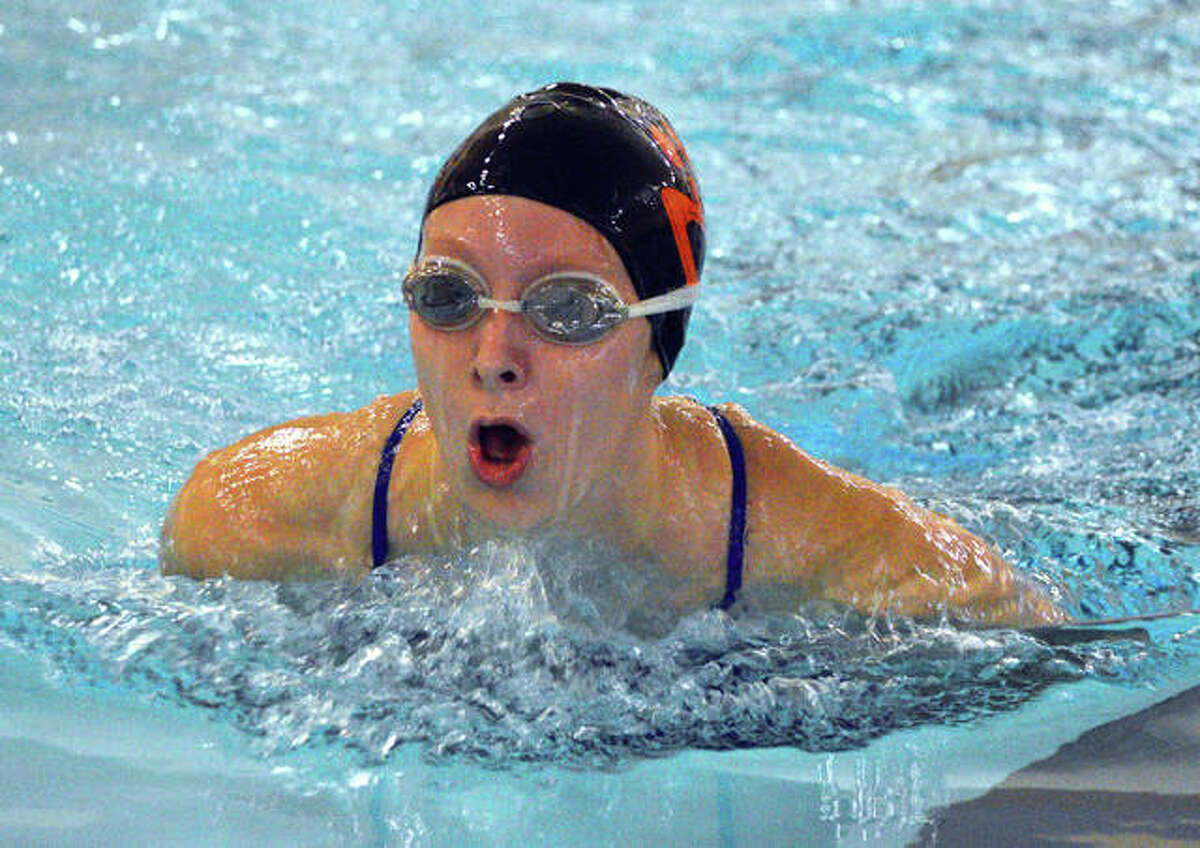 Edwardsville’s Taylor Wilkerson swims in the 100-yard breaststroke during Tuesday’s dual meet against Champaign Central at Chuck Fruit Aquatic Center.